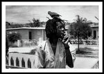 Peter Tosh Burning A Spliff In His Front Yard With His Parrot Freddie - Framed Print